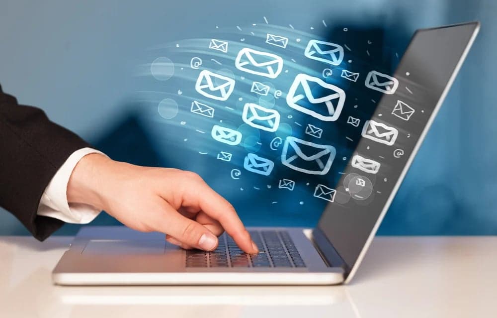 Image of a computer with email graphics